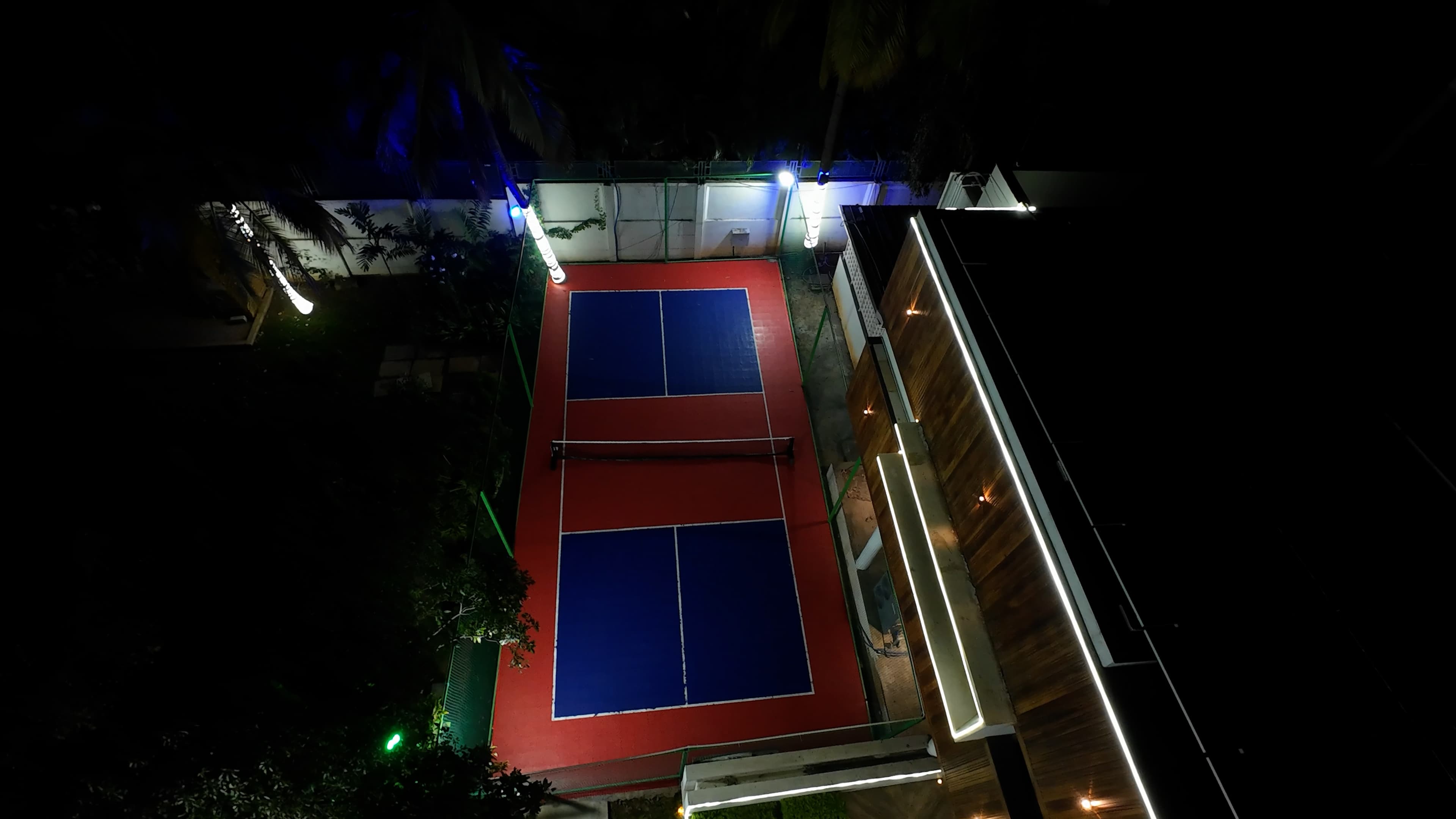 Pickleball court illuminated at night