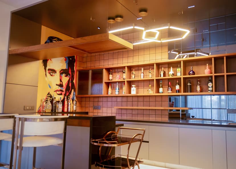 Night view of an illuminated luxury farm house in Bangalore for anniversary celebrations.